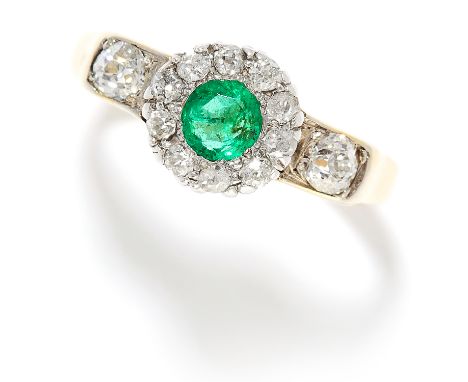 0.85 CARAT EMERALD AND DIAMOND RING in yellow gold, set with a round cut emerald of approximately 0.85 carats in a cluster of