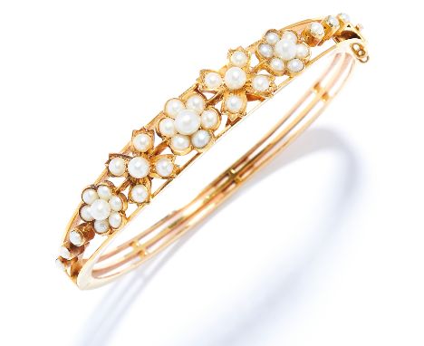 ANTIQUE PEARL BANGLE in high carat yellow gold, set with seed pearls in foliate motif, unmarked, 5.5cm inner diameter, 20.3g.