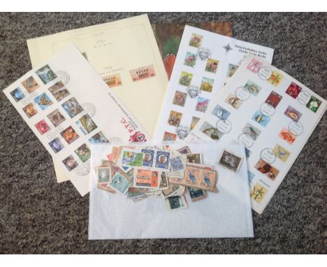 Assorted stamp collection. Stamps from South Africa and China. Cover from Rhodesia. Used British commonwealth stamps attached