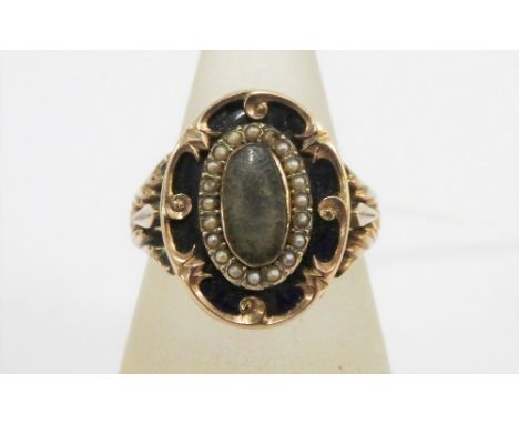 Antique gold Mourning ring, with oval plaque with a surround of seed pearls, on an unmarked pierced band, UK ring size R