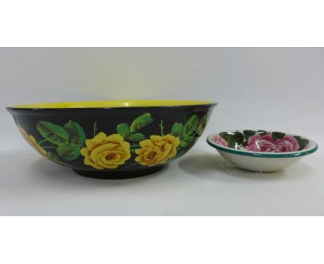 Wemyss black glazed basin with yellow rose pattern, restored, together with Wemyss cabbage rose pattern drainer, largest 39cm