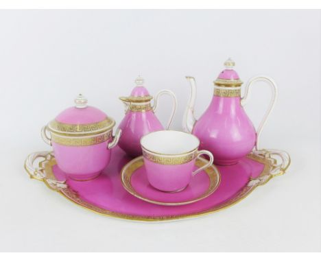 19th century pink and white glazed porcelain breakfast set with gilt Greek Key border comprising teapot (spout restored) milk