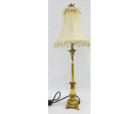 A contemporary faux gilt wood table lamp base and shade