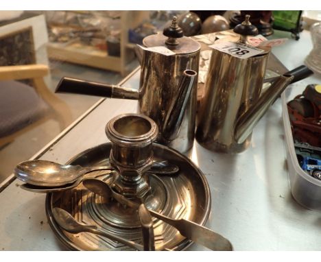 Pair of plated chocolate pots with ebonised handles with chamber stick and sugar tongs etc 