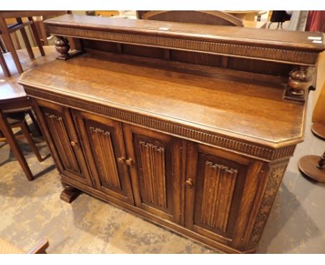 Antique oak panel sideboard with four cabinets