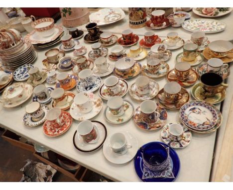 Large collection of souvenir coffee cup and saucers from around the world with small quantity of Gladstone ceramics 