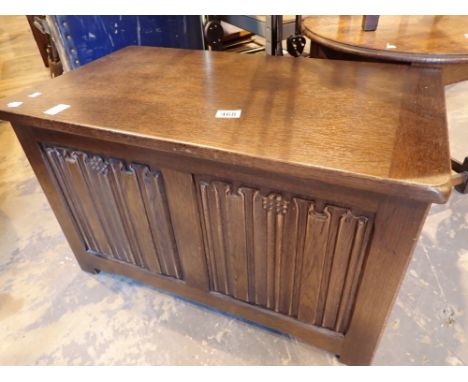 Oak blanket box with linenfold decorative panel