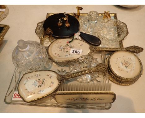 Two vintage dressing table sets and seven coloured glass animals 