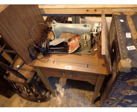 Vintage Alpha electric sewing machine in fitted sewing table 