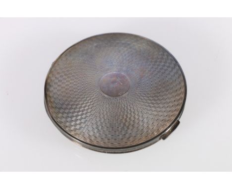 Art Deco silver compact with engine turned decoration by R Davis and Co Birmingham 1946, 8cm diameter, 120g gross 