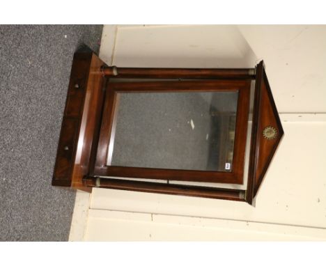 Early Victorian mahogany swing dressing mirror of architectural form with triangular arch top, the mirror flanked by columns 