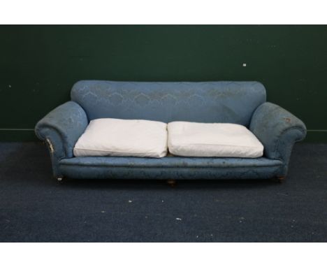 Large Victorian four seater sofa upholstered in blue floral pattern fabric raised on turned turnip supports with caster, 244c