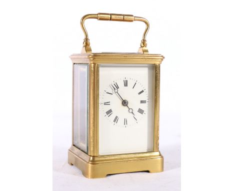 Brass carriage clock in typical style corniche case, 13cm tall 