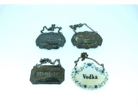 A pair of silver Wine Labels, hallmarked Sheffield, 1999, incised 'Vodka' and 'Brandy', together with another silver wine lab