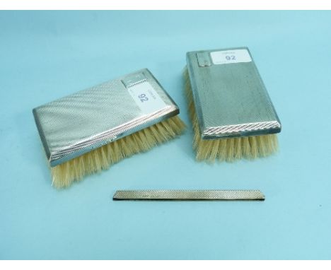 A George VI gentleman's three-piece silver-backed Brush and Comb set, hallmarked Birmingham, 1937, with engine-turned decorat