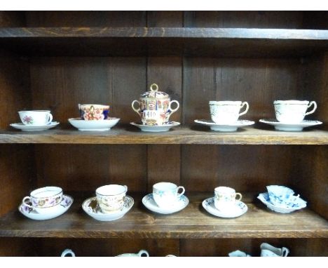Nine various decorative porcelain Cups and Saucers (9)