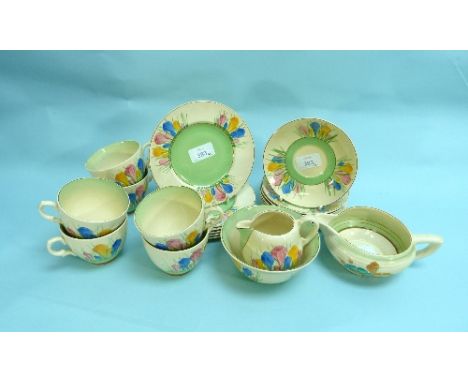 A Clarice Cliff 'Spring' Crocus-pattern twenty-piece Tea Service, comprising six cups and saucers, six tea plates, sugar bowl