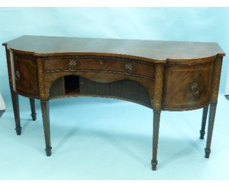 A Georgian Chippendale style flame mahogany Sideboard, of shaped rectangular concave form, the whole decorated with boxwood s
