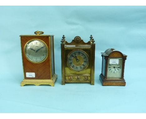 A mid-20thC Mantel Clock, signed 'Frodsham', the gilt-metal and walnut case with carry handle, 9in (23cm) high, together with