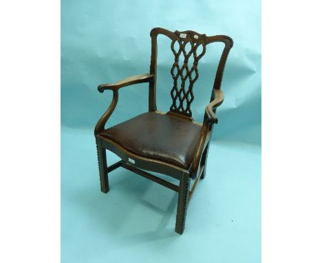 A Georgian Chippendale style mahogany Carver Chair, with carved ribbon effect pierced vase splat back, serpentine shaped fron