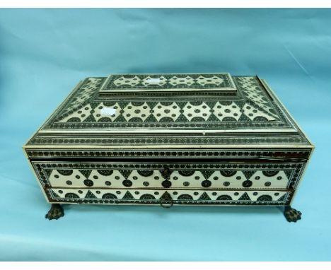 A 19thC Anglo-Indian Vizagapatnam ivory inlaid Work Box, of sarcophagus form with carry handles and claw feet, the hinged lid