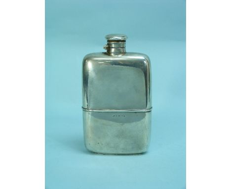 A Victorian silver Spirit Flask, hallmarked Birmingham, 1890, of rounded rectangular form with hinged bayonet cap and detacha