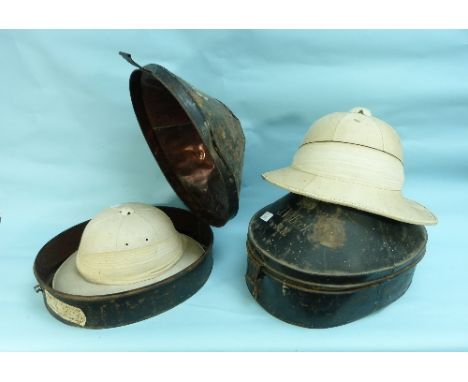 A Royal Navy Officer's Pith Helmet, by Gieves Ltd, in a Gieves black tin carry case, inscribed 'J. W. Beck, R.N.', together w