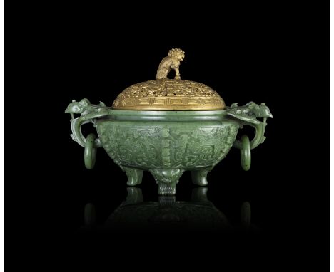A SPINACH-GREEN JADE ARCHAISTIC TRIPOD INCENSE BURNER 19世纪 碧玉仿古凤鸟纹双耳活环三足炉 China, 19th century The compressed globular body ca