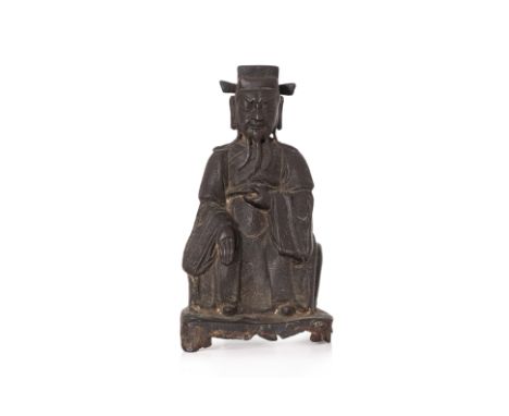 A SEATED BRONZE FIGURE OF GUANDI
Modelled wearing robe and futou headdress, left hand raised to chest plate and right hand fa