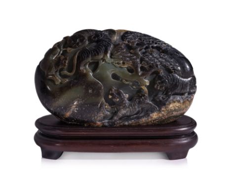 A SMALL JADE BOULDER CARVING ON STAND Oval form celadon and russet jade with relief carved decoration of tigers under a pine 