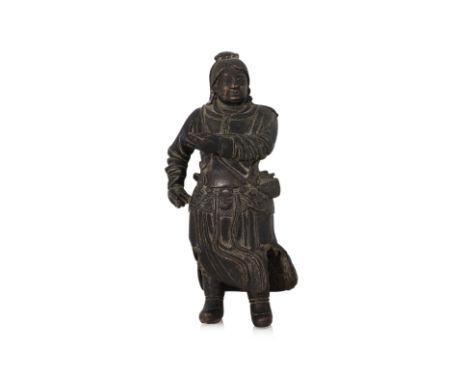 A BRONZE FIGURE OF LIU HAI Modelled standing wearing robe, a bag strung across his shoulder, his hands reaching out as if to 
