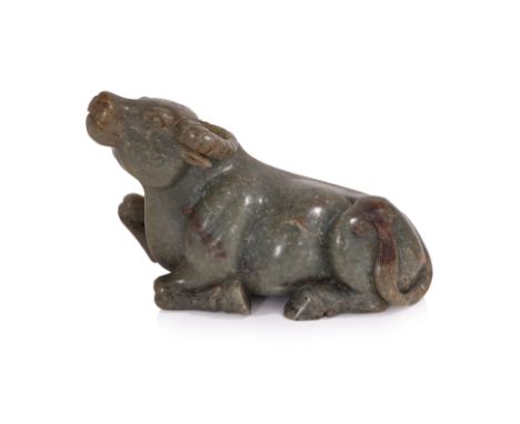 A JADE MODEL OF A RECUMBENT BUFFALO
Dark-green jade with small russet toned areas, modelled as a buffalo seated with legs tuc