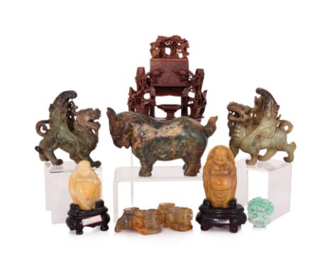 A LARGE GROUP OF CHINESE STONE CARVINGS
Comprising: two yellow polished hardstone buddhas; a dyed jadeite plaque; a pair of a