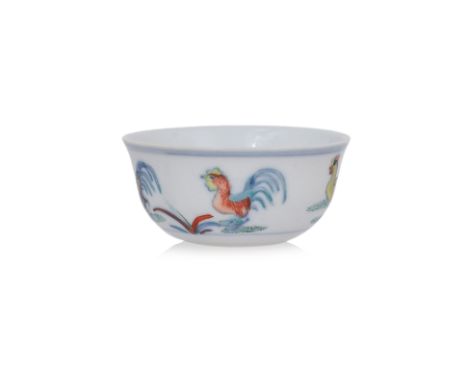 A DOUCAI PORCELAIN 'CHICKEN' CUP Qing Dynasty, Kangxi mark, delicately potted with slightly flaring sides, decorated in under