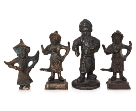 FOUR BRONZE FIGURES OF ZHOU CANG
The tallest example modelled standing and stroking his beard, standing on a circular base wi