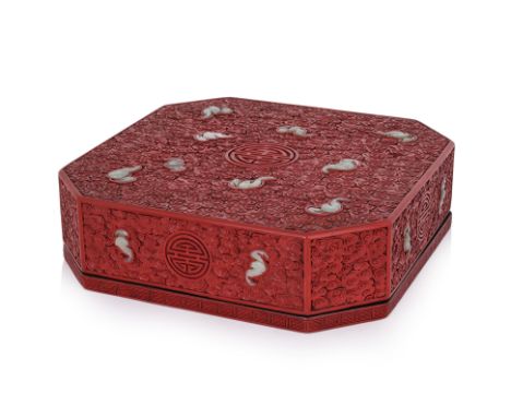 A LARGE JADE INSET CARVED CINNABAR LACQUER TABLE BOX
20th Century, square with cut corners, the lift off cover inset with car