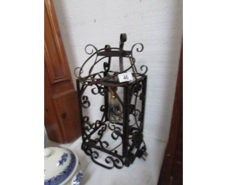 A wrought iron hall light