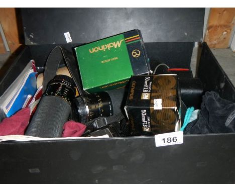 A mixed lot of 35mm camera equipment including various lenses