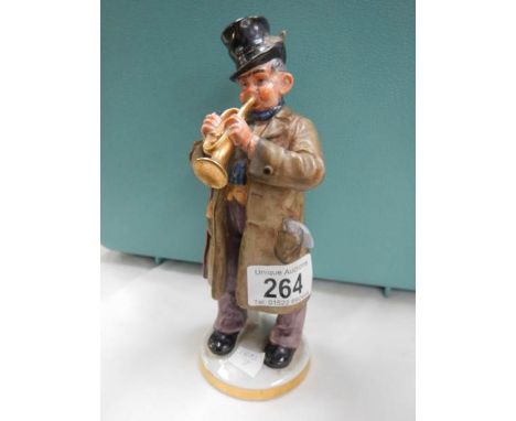 A Goebel musician figure playing a trumped