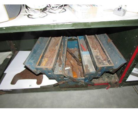 An old tool box, tools and old boot scraper