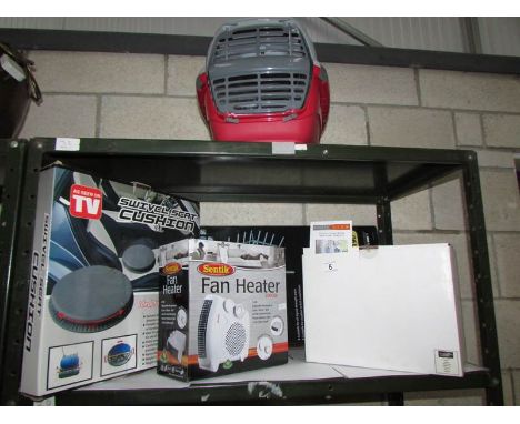 A pet carrier, fan heater, insect killer and swivel seat cushion