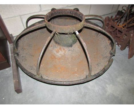 An old iron pig feeding trough