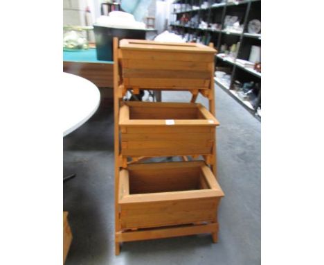 A 3 tier wooden garden planter