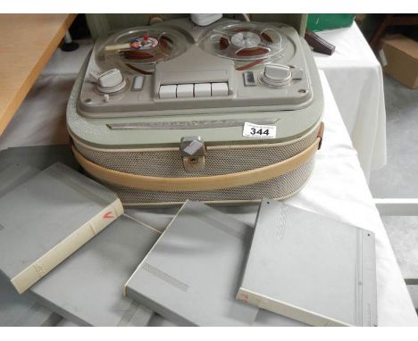 A reel to reel tape recorder and tapes