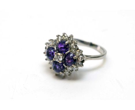 Amethyst and diamond ring, on white metal shank, ring size M.
