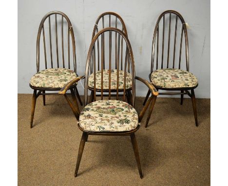 A set of four Ercol beech Quaker dining chairs, including one carver, each with hoop back, spindle supports above solid seat,