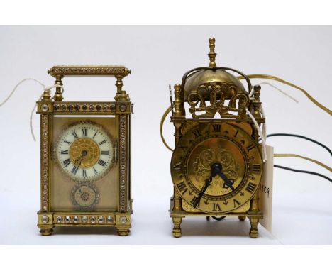 A miniature brass lantern clock by Smiths, 17cms high; together with a French brass carriage clock, with white gemstone detai
