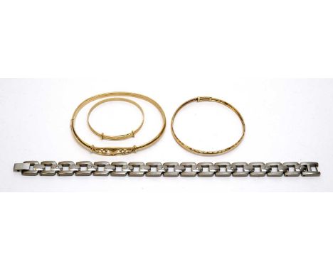 Three yellow metal bracelets, 8.8g gross; and a diamond set titanium bracelet.