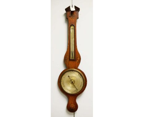 An early 20th Century mahogany barometer, the broken swan neck pediment with inlaid rosette above a silver thermometer with s