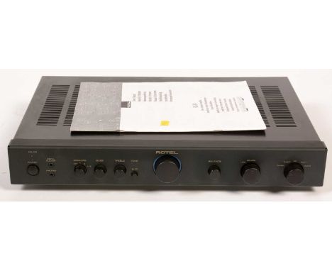 A Rotel RA-04 stereo integrated amplifier, boxed.